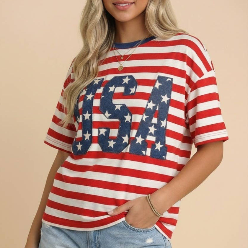 Woman wearing a red, white, and blue striped shirt with 'USA' design on a beige background
