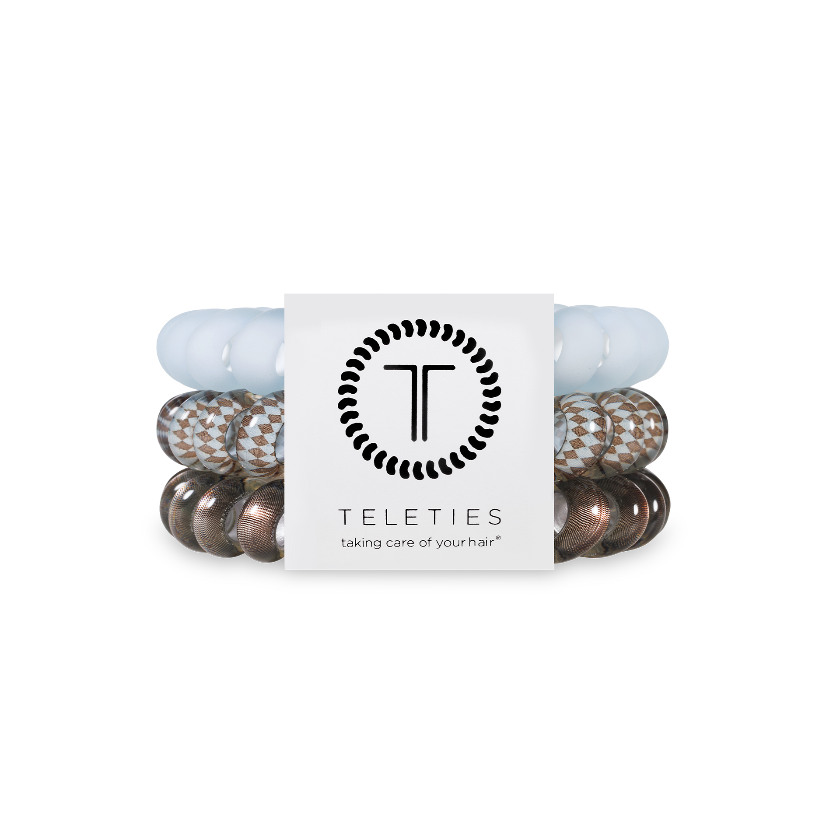 Set of hair ties with a brand label on a white background