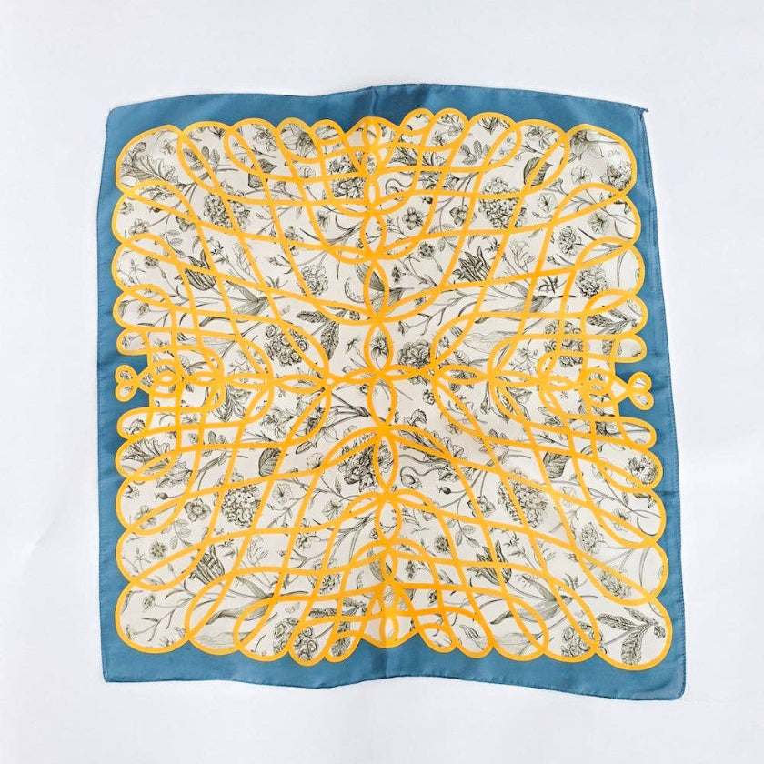 Square scarf with yellow floral pattern on a blue background