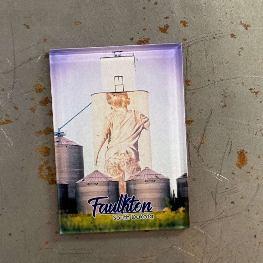 Small rectangular card with a printed design on a metallic surface