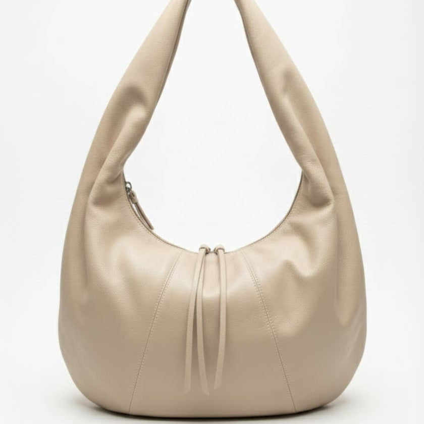 Beige handbag on a white background