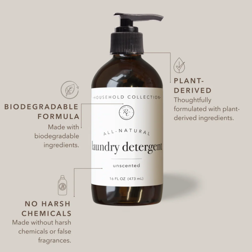 An amber glass bottle of laundry detergent with a black pump and white label, shown on a light beige background with callout text highlighting biodegradable formula, plant-derived ingredients, unscented, and no harsh chemicals.