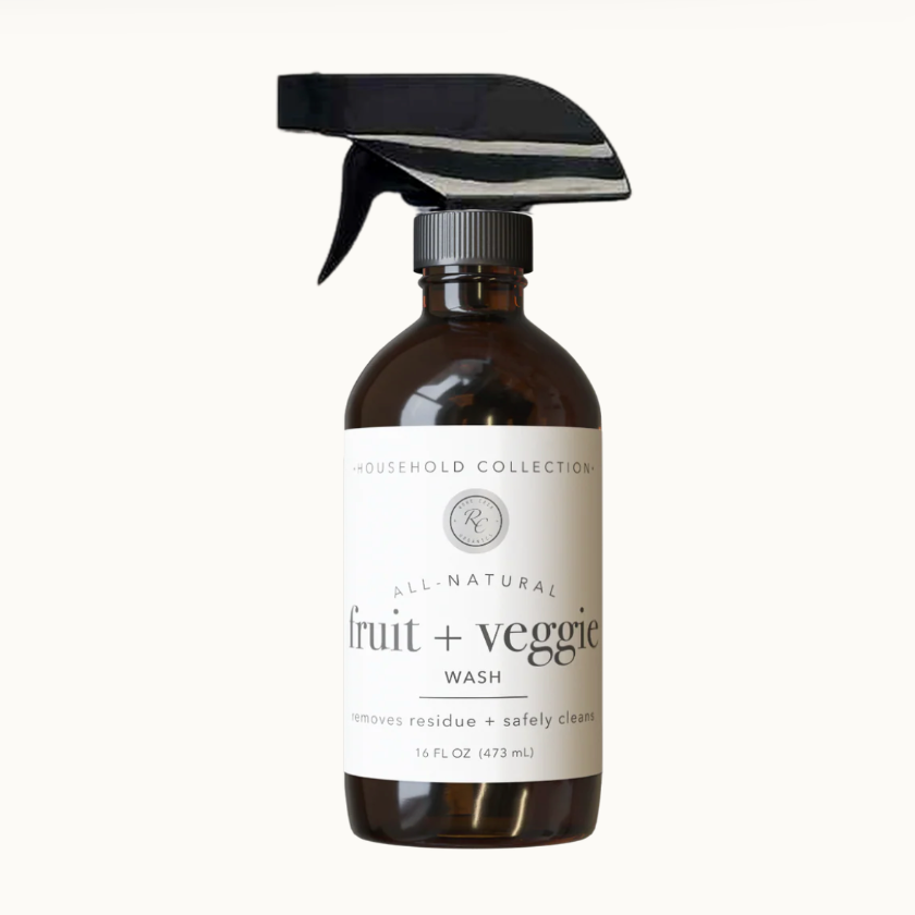 Brown spray bottle with black nozzle labeled 'Household Collection' on a white background