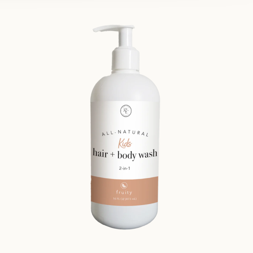A white pump bottle labeled 'All Natural Kids Hair + Body Wash 2-in-1 Fruity'