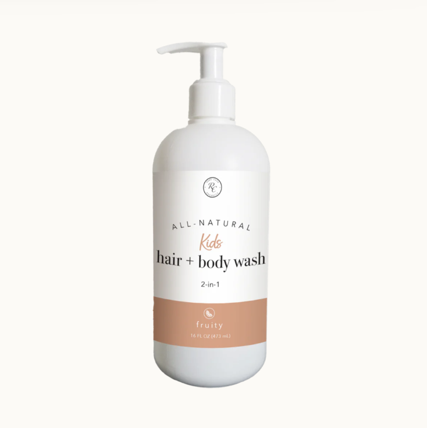 A white pump bottle labeled 'All Natural Kids Hair + Body Wash 2-in-1 Fruity'