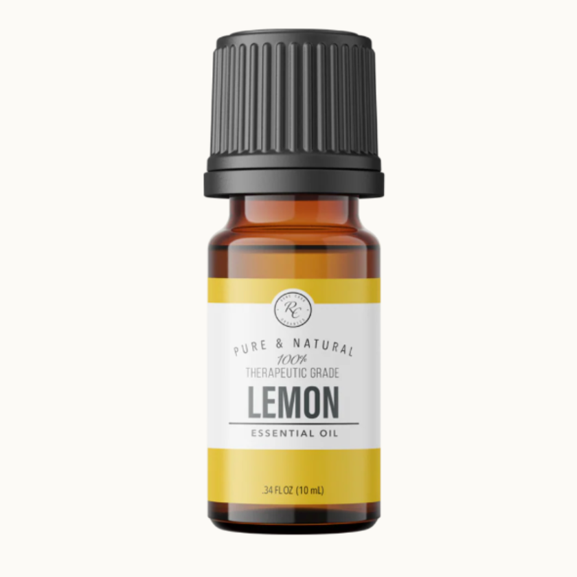 Lemon essential oil bottle with a black cap on a white background