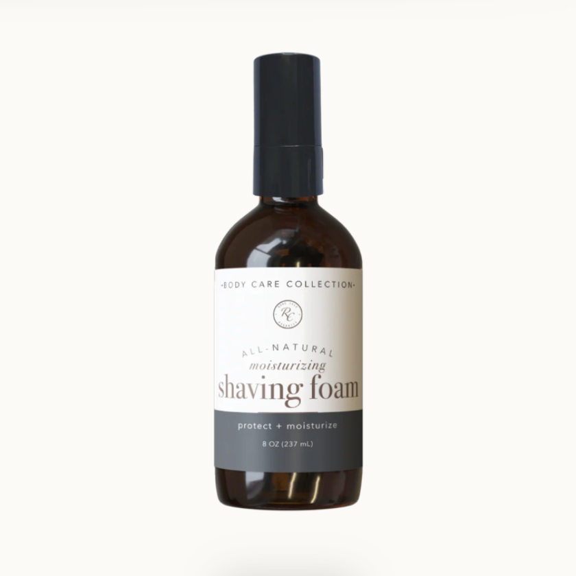 A bottle of Rowe Casa Organics Shaving Foam, 8 Oz size, with labels indicating it is all natural and organic.
