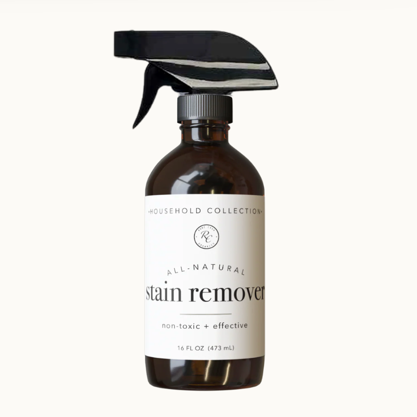 Bottle of all-natural stain remover on a white background