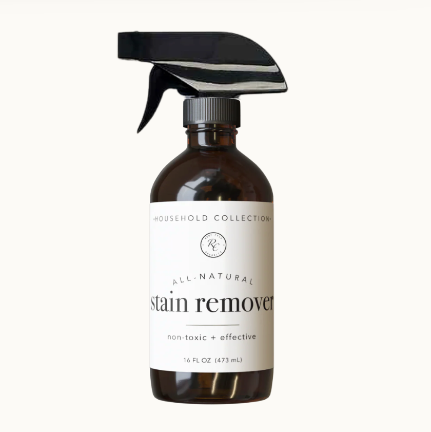 Bottle of all-natural stain remover on a white background