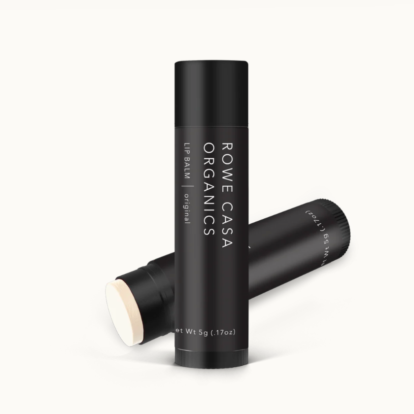 Two black lip balm tubes with 'Rowe Casa Organics' branding on a white background