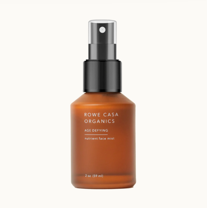 Brown spray bottle with black nozzle labeled 'Rowe Casa Organics' on a white background