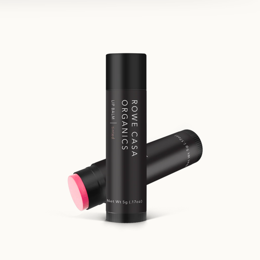 Two black lip balm tubes with a pink cap on a white background, featuring 'Rome Casa Organics' branding.