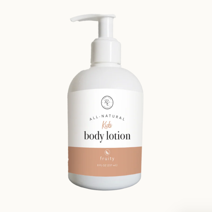 White bottle of kids' body lotion with a pump on a white background