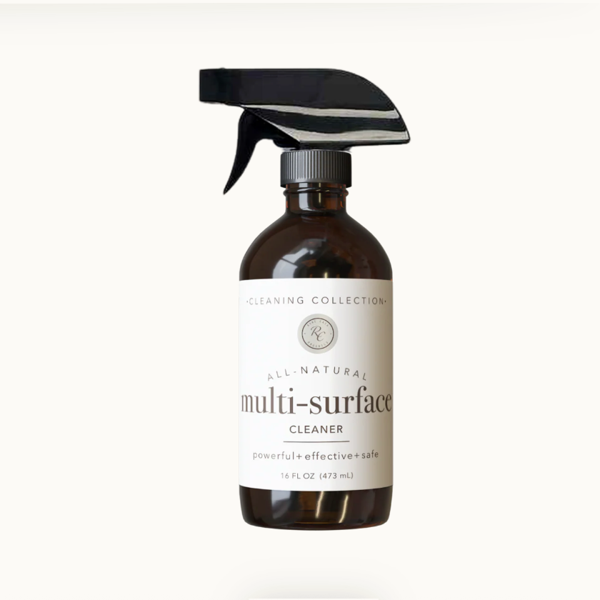 Brown spray bottle labeled 'All Natural Multi-Surface Cleaner' on a white background