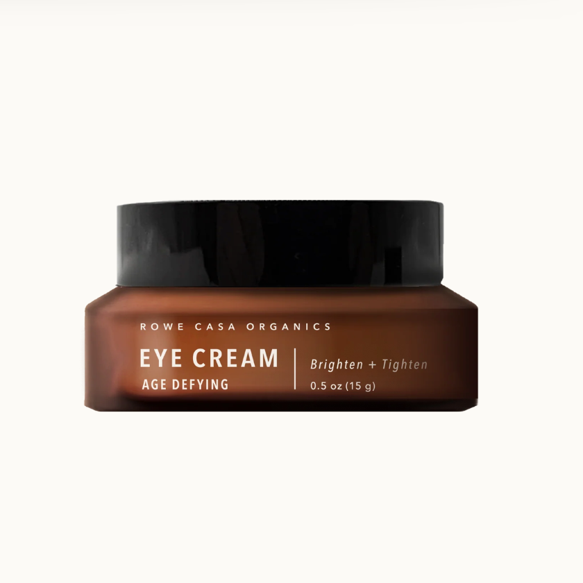 Brown jar of Rowe Casa Organics Eye Cream on a white background