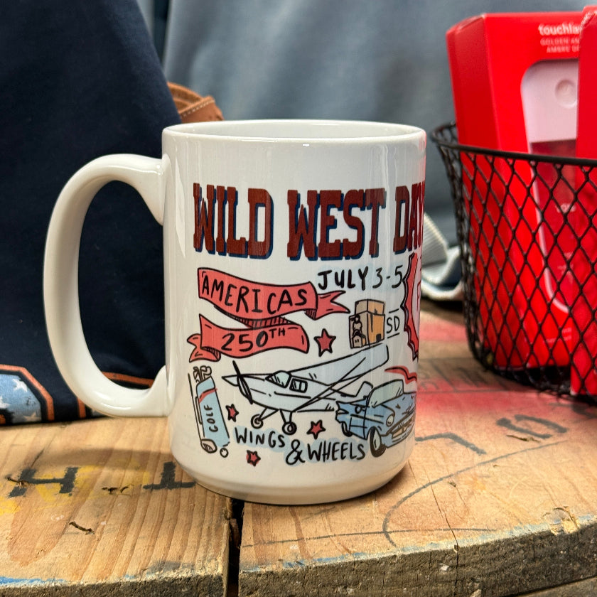 White mug with Wild West Day design on a wooden surface