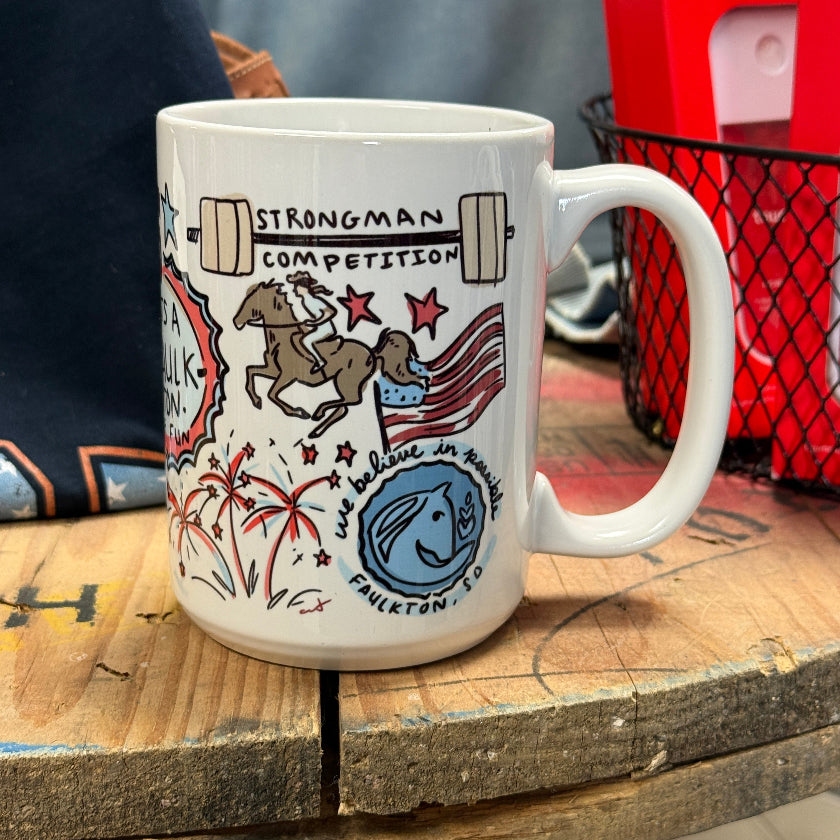 White mug with decorative design on a wooden surface