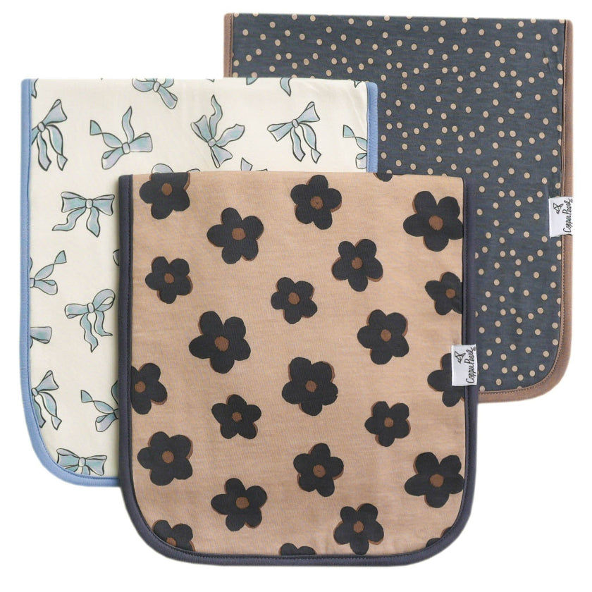 Three fabric pads with different patterns on a white background