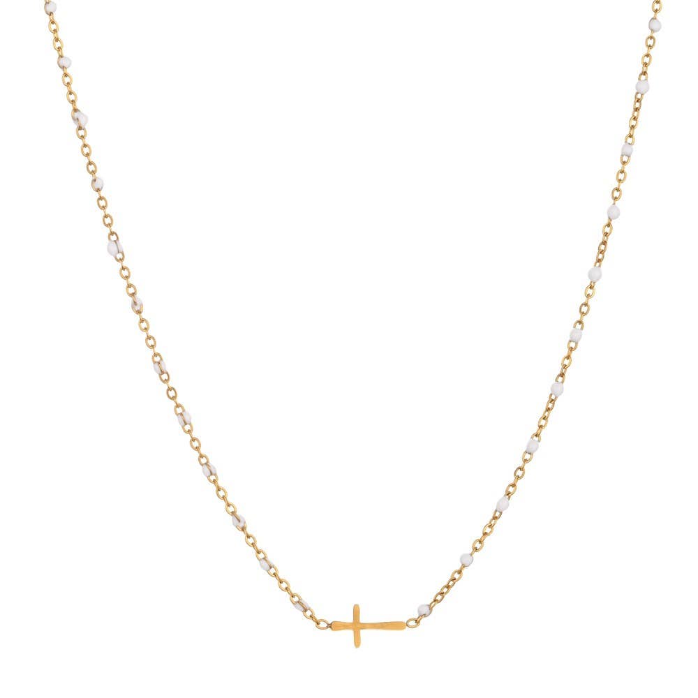 Gold necklace with a small cross pendant on a white background
