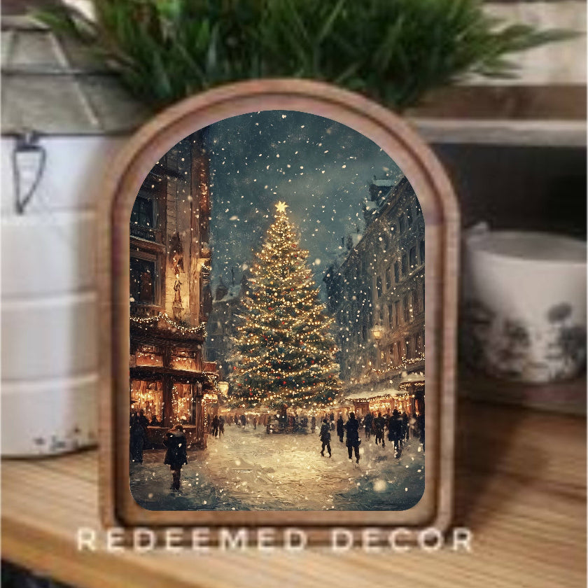 Decorative mirror with a Christmas scene on a shelf, featuring the brand 'Redeemed Decor'.