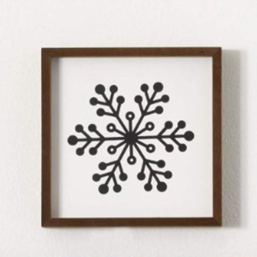 Perfect accents for your winter walls, this trio of framed snowflakes will look amazing all season long. Each of the three 7" wooden squares boast a modern & simple black & white look that fits in any setting.  Dimensions:
7"L x1.5"W x7"